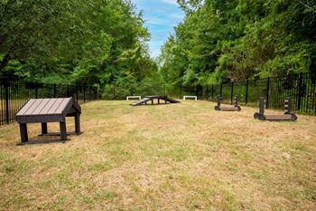 a park with a picnic table and benches